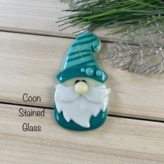 a glass ornament with an image of a gnome on it's face