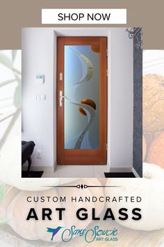 a glass door with the words custom handcrafted art glass on it and an image of pumpkins