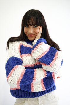 Our Zora Sweater is a soft chunky knit piece, intentionally designed as a luxury staple. The hand-knitted material and braided neckline is perfect for layering or by itself. Oversized, relaxed Royal blue, baby pink, and white vertical stripe detail Hand knitted Balloon sleeves with cinched wrists Royal blue braided neckline and bottom trim 100% Acrylic Your order will ship from our warehouse in Florida, USA! Knitted Swatches, Jersey Ideas, Thick Sweaters, Florida Usa, Fashion Designs, Blue Baby, Chunky Sweater, Cozy Knits, Striped Sweater