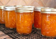 several jars filled with food sitting on top of a table