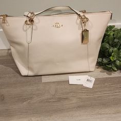 Coach Handbag. Off White. Nee With Tags. Chain Link Straps. White Everyday Bag With Handle Drop, White Tote Bag With Handle Drop, Everyday White Satchel With Handle Drop, White Shopping Bag With Gold-tone Hardware, Cream Bags With Gold-tone Hardware For Shopping, White Shopping Bags With Gold-tone Hardware, Chic Cream Coach Bag, White Coach Bag For Errands, Cream Shoulder Bag With Branded Hardware And Double Handle