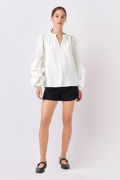 Look chic and sophisticated with this Blouson Sleeve Blouse! Crafted with a front button down closure and blouson sleeves this blouse adds a sleek touch to any look. The classic design and on-trend details make it perfect for any occasion. Band collared Front button down closure Blouson sleeves Back neck gatherings Hand wash cold Do not bleach Iron low Do not tumble dry Shell: 87% Rayon 13% Polyester Exclusive of decoration BH753T Total length :25" Bust :39" S Height 5'9" / Bust 32" / Waist 24" Blouson Sleeve, English Factory, Back Neck, Band Collar, Look Chic, Classic Design, Button Downs, Sleeve Blouse, Shirt Blouses