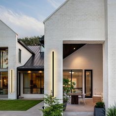 a modern house with white brick and black trim