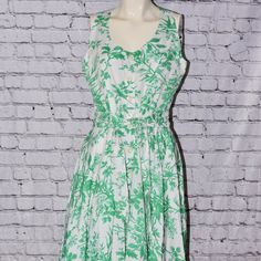 J.Peterman Toile De Jouy Sleeveless Dress Green & White Print Dress Size 6 New!! Perfect Designer Dress For Work Or Play Toile Print Dress In Cool Cotton With A Wonderful, Floral Botanical Print. Sleeveless, Scoop-Necked Dress With A Full Low-Calf Sweep. Shaping Princess Seams. A Dozen Poly Buttons Down Center Front. Wide Self-Tie Belt. Goes From Casual To Chic With No Visible Effort. Imported Dress: Size 6 Underarm-To-Underarm: 19" Top To Bottom: 48" Waist: 30" Measurements Are All Taken With G Sleeveless Fit And Flare Midi Dress For Garden Party, Lined Sleeveless Sundress For Daywear, Sleeveless Fit And Flare Midi Dress For Daywear, Sleeveless Fit And Flare Dresses For Daywear, Fit And Flare Sleeveless Midi Dress For Daywear, Green Sleeveless Lined Sundress, Lined A-line Sundress For Daywear, Lined Sleeveless Sundress For Garden Party, Green Sleeveless Sundress For Casual Occasions