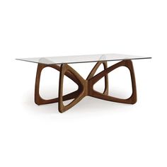 a glass table with wooden legs and an unusual design on the top, against a white background