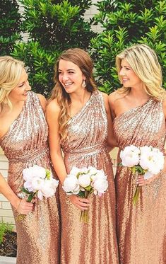 the bridesmaids are all dressed in gold sequins