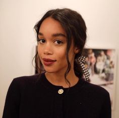 a close up of a person wearing a black sweater