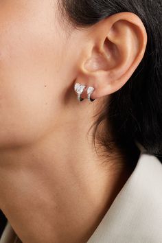 Repossi's single earring is part of 'Serti Sur Vide', which aligns with the jeweler's avant-garde collection. It's handcrafted from shining 18-karat white gold and set with a modern trio of pear-cut pavé diamonds. The sparkling design sculpts your lobe as if it's artistically floating. Luxury Pierced Huggie Earrings Gift, Silver Huggie Earrings Fine Jewelry For Everyday, Silver Huggie Earrings For Everyday Luxury, Fine Jewelry Sterling Silver Single Huggie Earring, Luxury Single Huggie Earring As Gift, Luxury Huggie Single Earring, Luxury Huggie Earrings With Prong Setting As Gift, White Gold Pierced Earrings For Everyday Luxury, Pierced White Gold Earrings For Everyday Luxury