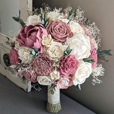 Please Read Entire Description Before Purchase Bouquet with sola wood flowers in pinkish mauve, dusty rose, and ivory, with baby's breath and faux greenery. Flower styles can and will vary based on current inventory levels and to keep orders unique, so they are not exact duplicates. Please include your choice of stem wrap and color (color of ribbon, white or ivory lace, or twine) in the notes section. Size pictured is an extra large (approximately 10" in diameter). Size shown in video is a mediu Ivory Bouquet, Wood Flower Bouquet, Bridal Gallery, Ribbon White, Dusty Rose Wedding, Sage Wedding, Faux Greenery, Bouquet Toss, Small Bouquet