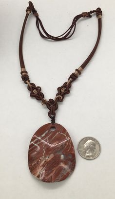 "Beautiful vintage huge red jasper carved pendant necklace in good condition and photos are part of the description measures 18\" length adjustable and the pendant is 2.5\" H. X 2.5\" W." Brown Carved Amulet Necklaces, Unique Carved Brown Necklace, Unique Brown Carved Necklace, Brown Artisan Necklace With Large Pendant, Artisan Brown Necklace With Large Pendant, Adjustable Carved Brown Necklace, Brown Pendant Necklace With Large Pendant, Artisan Red Jasper Necklaces, Brown Carved Pendant Necklace