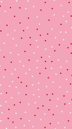 a pink background with white and red polka dots