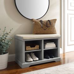 a mirror and some shoes on a shelf