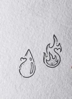 two drawings of fire and water on white paper