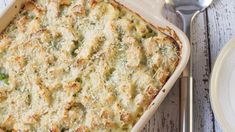 a casserole dish with broccoli and cheese in it on a plate