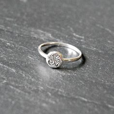 This 925 sterling silver ring features a shiny hammered disk with a stamped ohm symbol on a smooth, slender band. ✩ Sterling silver disk is 7.5mm wide; sterling silver band is 1.5mm. Choose from a US size 5, 6, 7, or 8. All components are sterling silver. ✩ Comes beautifully packaged as shown in a branded box with care instructions. If this is intended as a gift, please let us know when you check out...that way we can include a blank gifting card for you! ~ Please be sure to read my shop policie Sterling Silver Spiritual Toe Midi Rings, Nickel Free Spiritual Toe Rings, Spiritual Nickel-free Toe Rings, Sterling Silver Spiritual Toe Ring, Spiritual Stackable Toe Rings, Spiritual Nickel-free Silver Stackable Rings, Spiritual Sterling Silver Stackable Promise Rings, Spiritual Sterling Silver Stackable Rings, Symbolic Sterling Silver Stackable Rings