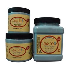 three jars of dixie ble blue colored paste sitting next to each other on a white background