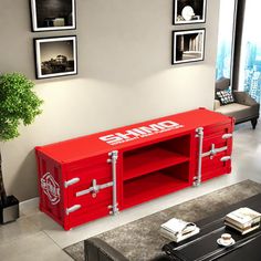 a living room with a large red entertainment center in the middle of it's floor