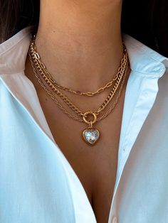 Dive into the chic vibe with our gold layered necklaces - whether you're going solo for a personalized touch or mixing it up with a combo, it's all about your unique style. Take your pick from the drop-down menu and slide into our DMs for any questions or special requests. Your style, your rules - let's elevate it together! Gold Plated Chain Necklace For Valentine's Day, Valentine's Day Gold Plated Chain Necklace, Gold Heart Necklace With Gold Chain, Gold Plated Clavicle Chain Jewelry For Valentine's Day, Gold Plated Clavicle Chain For Valentine's Day, Valentine's Day Gold Plated Clavicle Chain Jewelry, Luxury Heart-shaped Necklace With Delicate Chain, Heart Shaped Gold Plated Chain Jewelry, Yellow Gold Plated Heart Jewelry