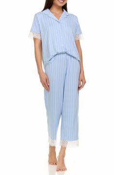 Drift off into dreamland in these seriously soft striped pajamas that pair a lace trimmed button-up shirt with matching cropped elastic-waist pants. 25" inseam (size Small) Top has front button closure; notched collar; short sleeves Pants have elastic waist 95% polyester, 5% spandex Machine wash, tumble dry Imported Striped Pajamas, Flora Nikrooz, Concert Looks, Preppy Look, Elastic Waist Pants, Sweaters And Leggings, Comfortable Sandals, Notched Collar