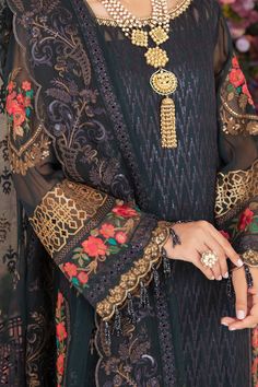 Traditional Black Embroidered Pakistani Salwar Kameez Dupatta Suit is gorgeous outfit is adorned with an exquisite of floral embroidered canvas creating a timeless design. Intricate designs and fine details of thread make this beautiful Pakistani Salwar Kameez Suit an epitome of beauty and grace. Embroidered Kameez: This mesmerizing kameez is adorned with intricate embroidery on the front, back, and sleeves making the elegant design. The neckline is alluring with hand-crafted details making this Organza Trousers, Net Sleeves, Pakistani Style, Pakistani Salwar, Organza Sleeves, Pakistani Salwar Kameez, Unique Outfit, Embroidered Chiffon, Embroidered Organza