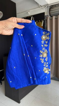 Product Descriptions : Royal blue silk blouse comes with intricate floral motif hand work for back & tikki works all over the blouse as shown View this post on Instagram A post shared by Handcrafted Sarees by Shobana Nithin (@threadslabel_india) Semi-stitched Silk Blouse Piece With Dabka Work, Festive Straight Kurta Blouse With Dabka Work, Bollywood Style Dabka Work Kurta Blouse, Silk Blouse Piece For Designer Wear During Navratri, Blue Blouse Piece With Dori Work For Navratri, Blue Designer Tops With Zari Work, Designer Blue Tops With Zari Work, Raw Silk Blouse Piece With Dabka Work For Party, Party Blouse With Dabka Work For Diwali