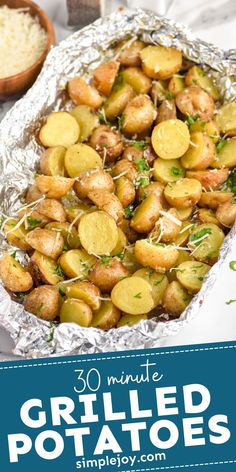 grilled potatoes with parsley on top in tin foil and next to a bowl of rice