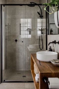 a bathroom with two sinks and a shower