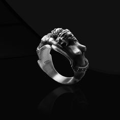 Symbol Of Genesis Adam Eve Ring Introducing our exquisite Symbol Of Genesis Adam Eve Ring, a stunning piece of Christian couple jewelry that beautifully captures the essence of this timeless biblical tale. Crafted with meticulous attention to detail, this oxidized silver brutalist ring is an artistic representation symbolizing the embrace of Adam and Eve in the Garden of Eden. The raw oxidized finish adds a touch of rugged charm to this unique accessory, making it a perfect gift for couples seeking a meaningful and stylish way to express their faith and love. Embrace the story of Genesis with this one-of-a-kind ring that will surely make a striking statement. Product Code: FRTGA102 Product Name: Symbol Of Genesis Adam Eve Ring Metal: Handmade oxidized 925 Sterling Silver Rings (Can also be Brutalist Ring With Oxidized Finish As Gift, Brutalist Oxidized Finish Ring As Gift, Brutalist Sterling Silver Rings As Gift, Adjustable Nickel-free Silver Skull Ring, Silver Brutalist Hand-cast Rings, 22 Carat Gold, Couple Jewelry, The Embrace, Adam And Eve