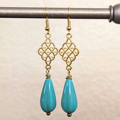 - New & Handmade - Materials: Turquoise Blue Czech Glass Teardrops, Gold Metal Filigree Connectors, 14k Gold-Filled Fishhook Ear Wires - Length: 2 3/4" Including Hook Elegant Turquoise Teardrop Pierced Earrings, Elegant Handmade Turquoise Teardrop Earrings, Elegant Blue Hypoallergenic Teardrop Earrings, Elegant Turquoise Drop Teardrop Earrings, Blue Filigree Dangle Jewelry, Elegant Turquoise Teardrop Earrings, Elegant Turquoise Teardrop Earrings As Gift, Vintage Christmas Earrings, Celebrities Earrings