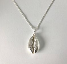 i picked this shell up on Bingin Beach Bali~ I made a mould of the shell so i could make a replica of the shell in sterling silver. The height of the shell is 16mm and it comes on a 45 cm sterling silver chain. Handmade Sterling Silver Shell-shaped Necklace, Sterling Silver Shell Necklace For Gift, Silver Sterling Silver Shell Pendant Necklace, Silver Sterling Silver Pendant Shell Necklace, Handmade Sterling Silver Shell, Silver Beach Jewelry, Bingin Beach, Beach Bali, Bali Jewelry