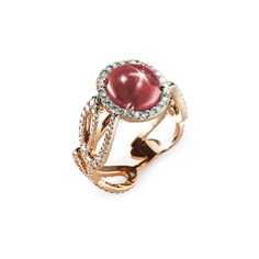 a ring with an oval shaped red stone surrounded by diamonds