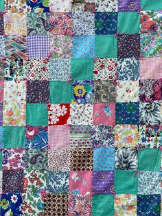 an old patchwork quilt with many different colors