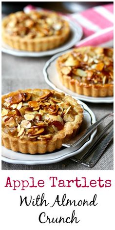 apple tartles with almond crunch on top and in the background are two white plates