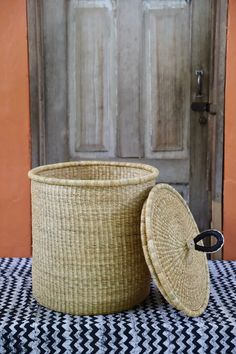 a basket sitting on top of a table next to a door