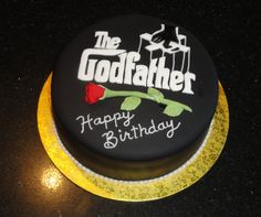 a birthday cake with the words'the godfather'on it and a rose