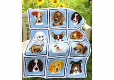 a crocheted afghan with dogs on it sitting in the grass next to sunflowers