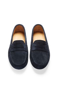 Moccasin style driving loafers in luxurious blue suede outer and lined with a soft leather for extra comfort. A great staple colour for any wardrobe. We also offer this same navy blue suede in tasselled or the full rubber soled penny version. Made in Portugal. MATERIAL 100% suede upper featuring a 100% leather Liningrubber studded sole Navy Suede Loafers With Rubber Sole, Navy Suede Slip-on Loafers, Navy Suede Loafers For Formal Occasions, Classic Blue Moccasins With Suede Lining, Classic Blue Loafers With Suede Lining, Classic Navy Loafers With Leather Sole, Classic Blue Suede Slip-ons, Classic Blue Moccasins With Stitched Sole, Classic Navy Leather Boat Shoes