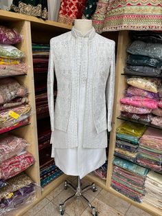 Introducing our Ivory Open Jacket Sherwani with Thread Work and Button Down Kurta Inside, enhanced with Mirror Work and Red Hints All Over the Sherwani, a luxurious and stylish traditional garment perfect for weddings or any special occasion. Made from high-quality materials, this sherwani features intricate thread wor Open Jacket Sherwani, Mens Sherwani, Indian Bridal Lehenga, Open Jacket, Mirror Work, Modern Traditional, Thread Work, Bridal Lehenga, Indian Bridal