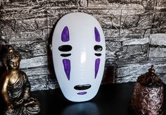 Crafted meticulously, this intricately designed Kaonashi mask, fashioned with 3D printing technology, captures the essence of the iconic character flawlessly. Each detail is painstakingly hand-painted, ensuring the intricate features of the enigmatic No-Face come to life. Ideal for cosplay enthusiasts, Halloween aficionados, or collectors seeking a standout addition to their repertoire. Constructed from premium materials, this exceptional piece is not only visually striking but also built to end White Masks For Cosplay Events, White Full Face Mask For Cosplay Events, White Full Face Mask For Cosplay, Handmade Halloween Cosplay Mask, White Mask For Cosplay, White Mask Costume Accessories For Cosplay, White Cosplay Costume Mask, White Masks And Prosthetics For Masquerade And Cosplay, White Costume Masks For Cosplay Events