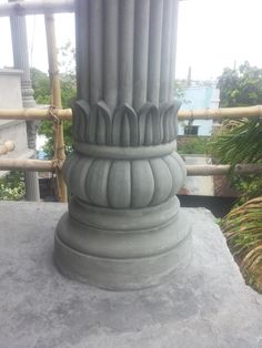 a close up of a stone column on top of a building