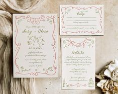 the wedding stationery is laid out on top of an old piece of paper, which has been decorated with red and green designs