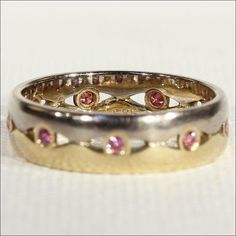 There are some pieces that I really wouldn't mind keeping in my permanent collection. This fantasy of a ring appeals to my girly side. It's half yellow gold and half white gold and set around it are nine very glittery pink diamonds. Two colors of gold playing with pink, the perfect stacking ring, makes me swoon just a bit! This vintage ring was hand crafted around 1970 and has just one mark of '585' indicating it's 14 karat gold content. The diamonds are about .03 carats each for about .36 carat Elegant Multi-stone Pink Sapphire Diamond Ring, Elegant Pink Gold Rings With Bezel Setting, Elegant Pink Gold Ring With Bezel Setting, Wedding Rings With Pink Sapphire In Bezel Setting, Elegant Multi-stone Diamond Ring With Pink Sapphire, Wedding Pink Sapphire Ring With Bezel Setting, Formal Pink Rings With Polished Finish, Exquisite Pink Sapphire Rings For Formal Occasions, Exquisite Pink Sapphire Rings For Formal Events