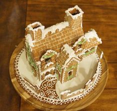 a gingerbread castle is sitting on a plate