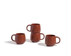 three brown mugs sitting next to each other