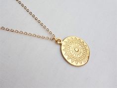 Sun medallion gold plated necklace. The sun charm is approx 2.5 cm high; all components of the necklace are gold plated. This minimal necklace can be worn layered or on its own. Model wears length 60cm. For other gold plated layering necklaces, see these listings: https://www.etsy.com/uk/shop/Kemeria?ref=seller-platform-mcnav&section_id=26436855 The necklace will be packaged in tissue paper and an organza bag. Minimal Necklace, Celestial Necklace, Gold Plated Necklace, Coin Pendant, Organza Bags, Layered Necklaces, Charm Necklace, Necklace Etsy, Gold Plate