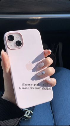 a woman's hand holding an iphone case