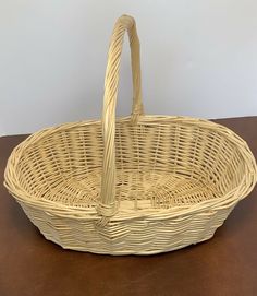 a wicker basket sitting on top of a wooden table