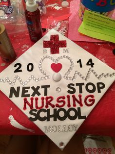 a graduation cap with the words new school year on it and other items around it