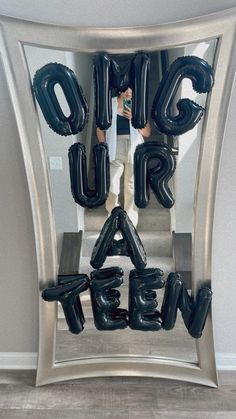 a man standing in front of a mirror with the words save air written on it