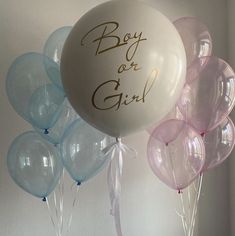 a bunch of balloons that say boy or girl